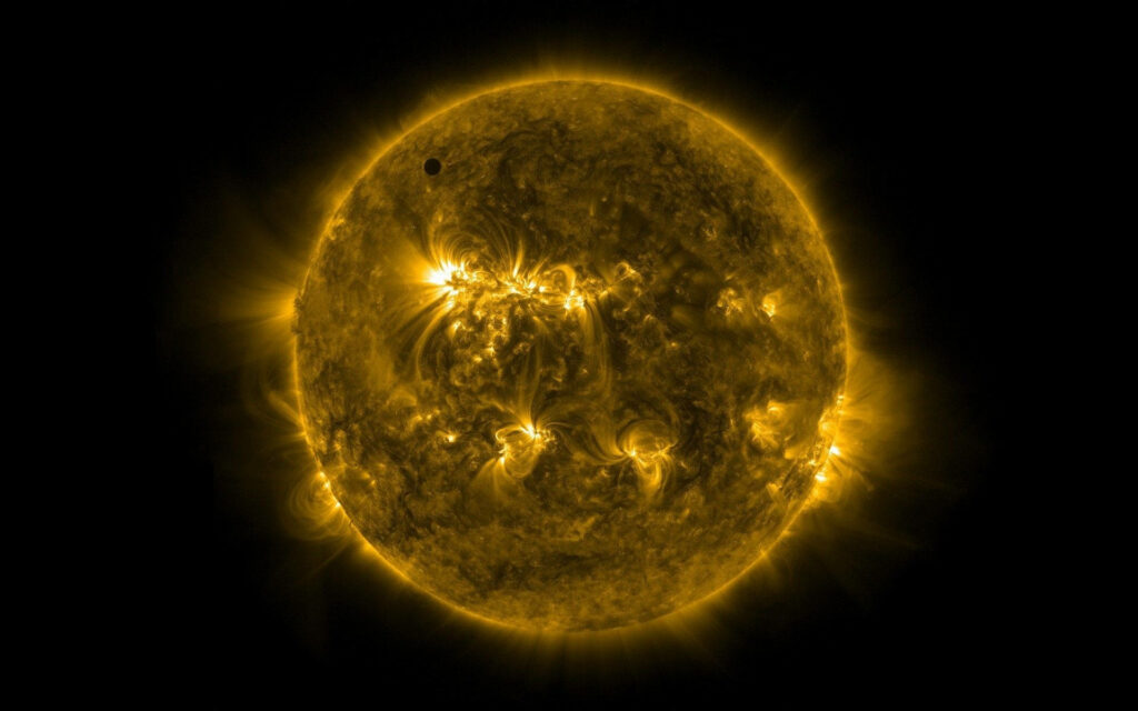 Vibrant Sun Wallpaper: Fiery Flares on Dark Background