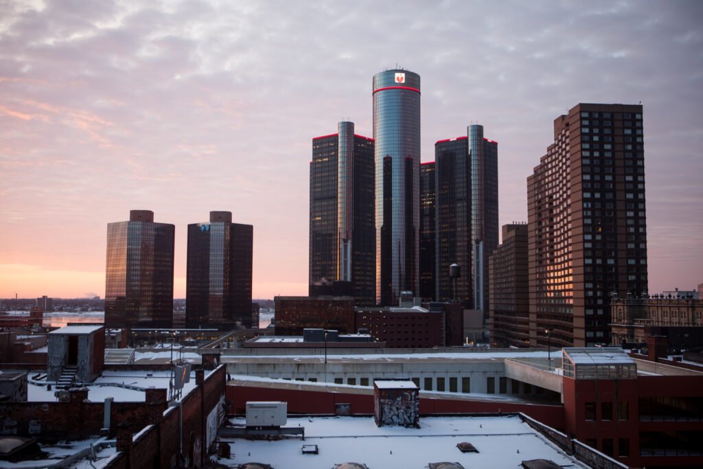 Stunning Cityscape Sunrise Wallpaper: Modern Architecture & Snowy Rooftops
