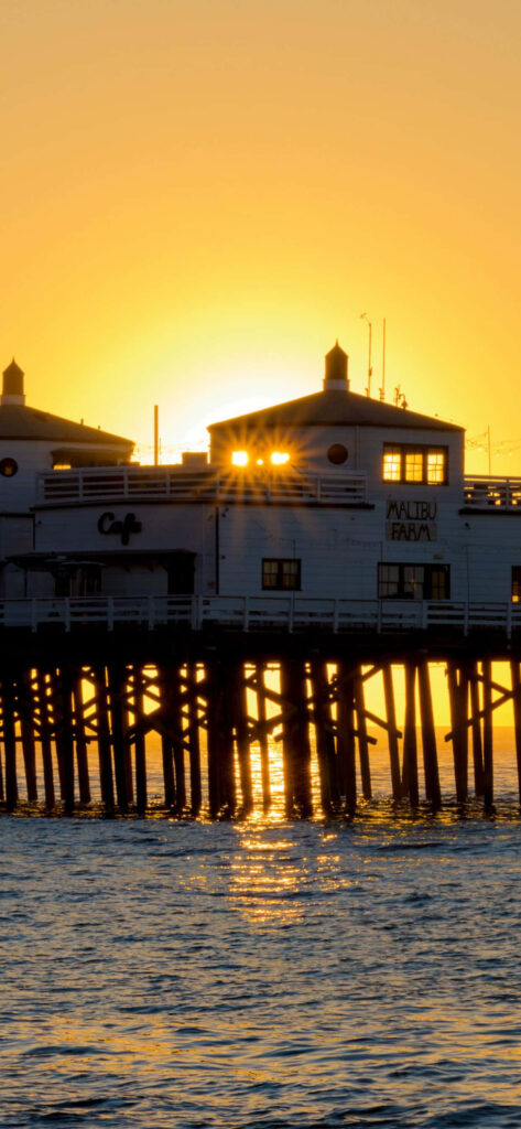 Stunning Sunrise at Docks: Serene Golden Glow Wallpaper