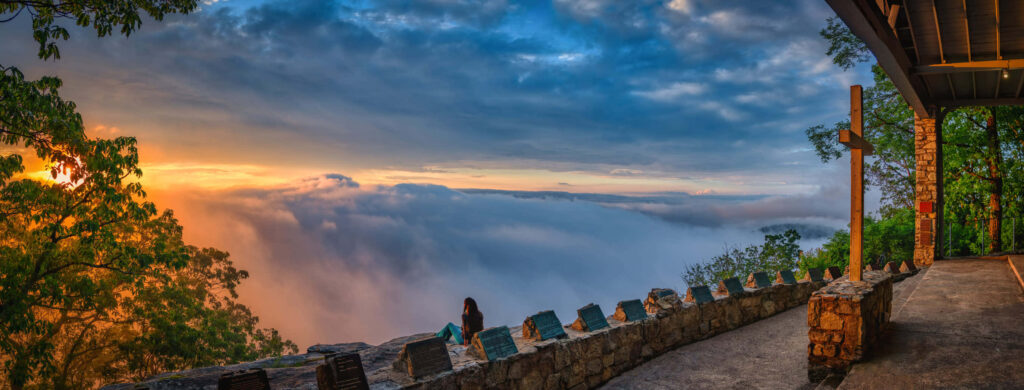 Serene Sunrise Panorama: Blue Sky, Dramatic Clouds & Lush Forest Wallpaper