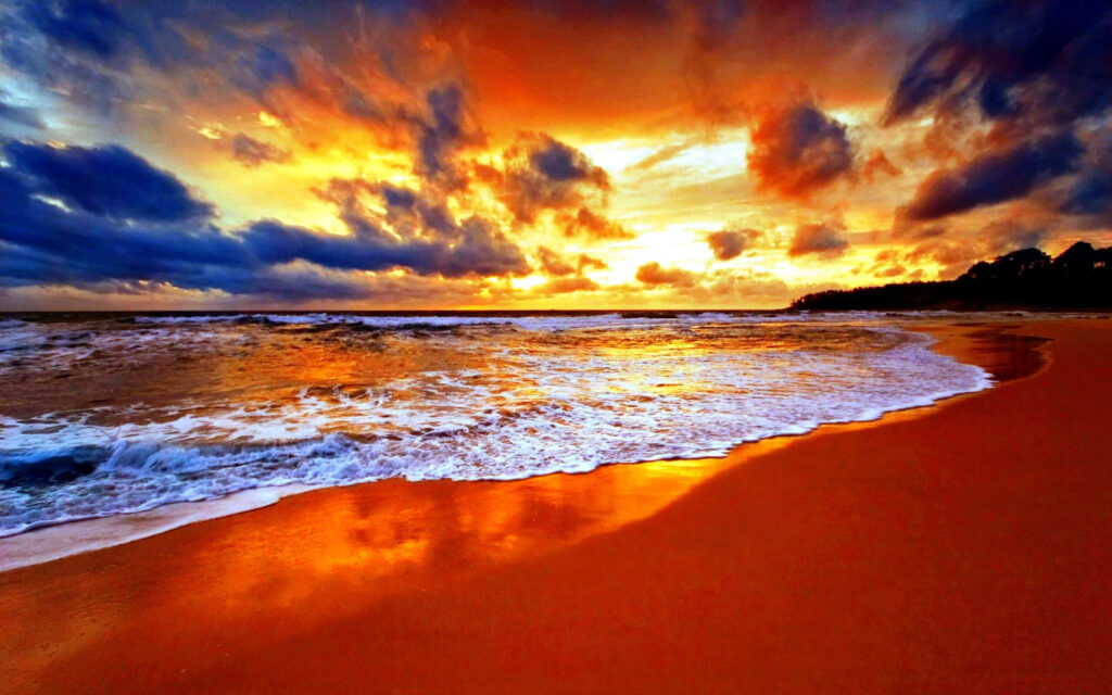 Stunning Sunset Beach Scene: Vibrant Orange and Gold Reflection Wallpaper