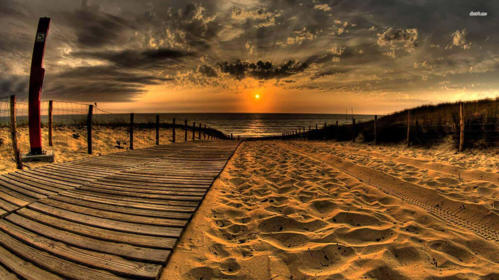 Breathtaking Sunset Beach Wallpaper with Wooden Walkway Background