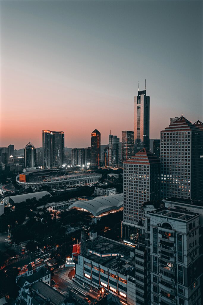 Stunning Cityscape Sunset Wallpaper: Aerial View of Urban Skyline