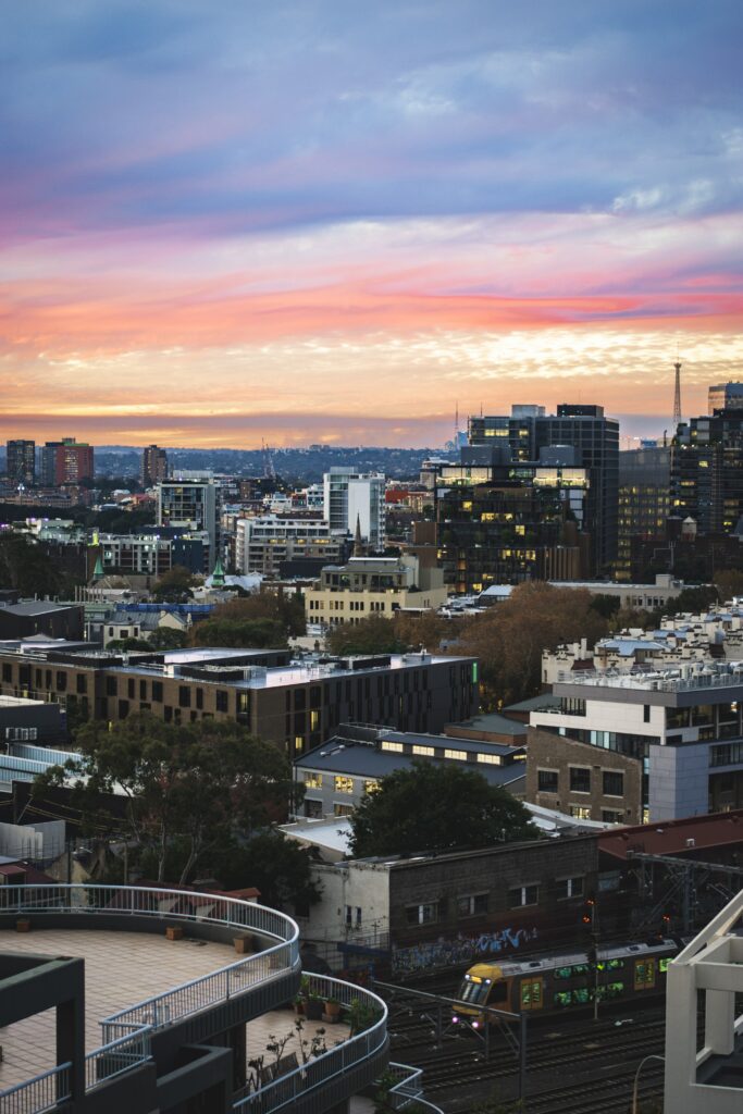 Stunning Cityscape Sunset Wallpaper: Urban Architecture & Serene Hues