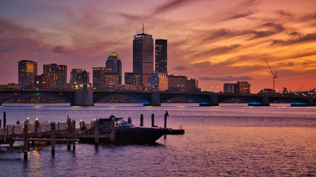Stunning Sunset Cityscape Wallpaper: Vibrant Architecture & Calm Water