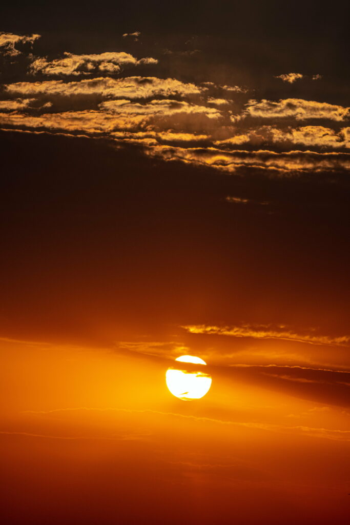 Stunning Sunset HD Phone Wallpaper: Serene Cloudy Sky Background