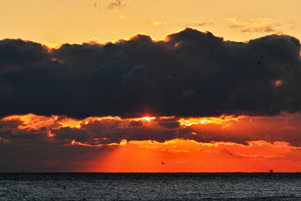 Stunning Sunset Over Sea: Dramatic Clouds & Fiery Dusk Sky Wallpaper