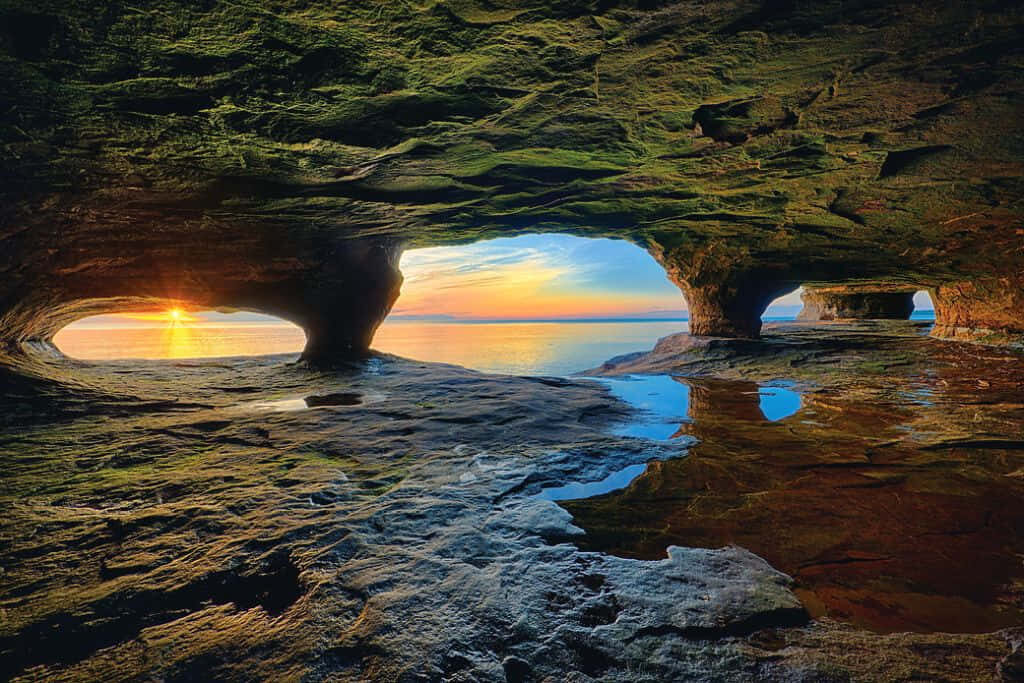 Serene Sunset over Au Train Point Caves - Great Lakes Wallpaper