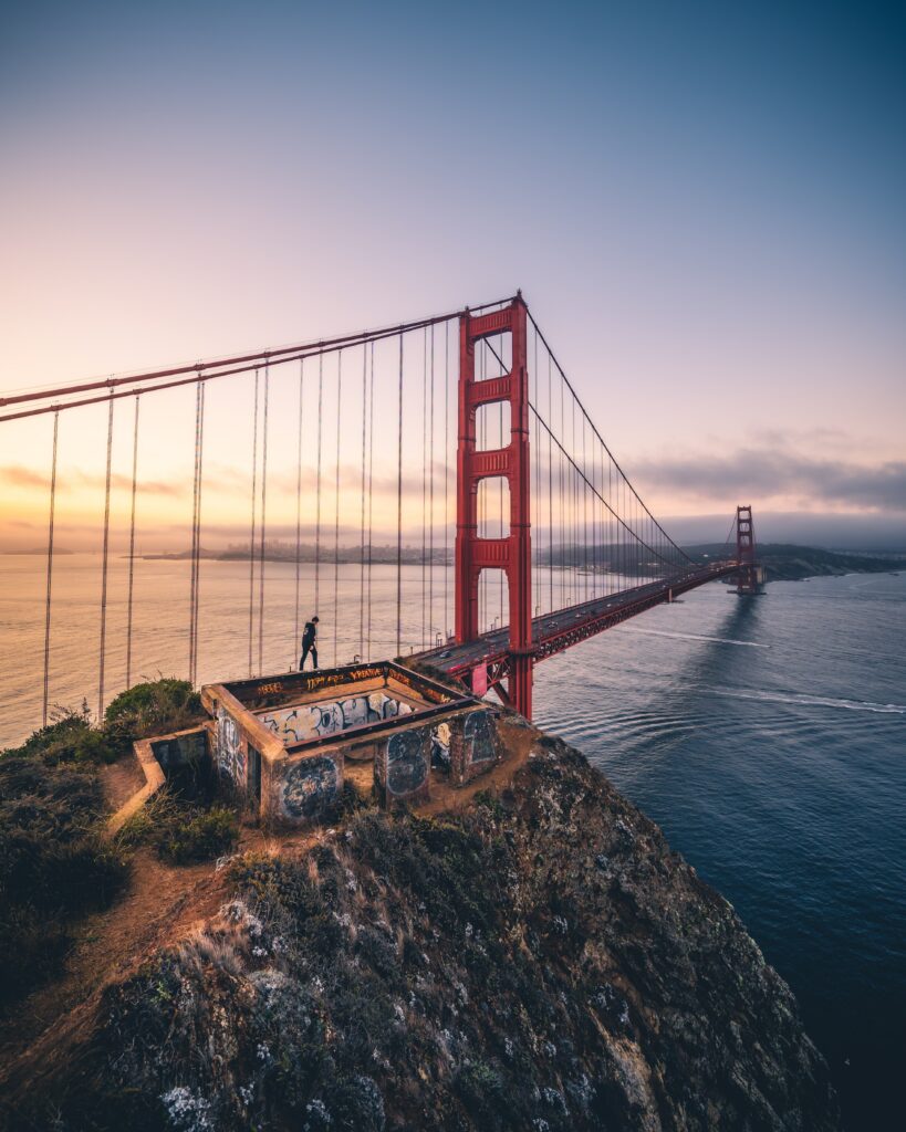 Stunning Sunset Wallpaper of a Bridge Over Serene Bay - Nature & Architecture