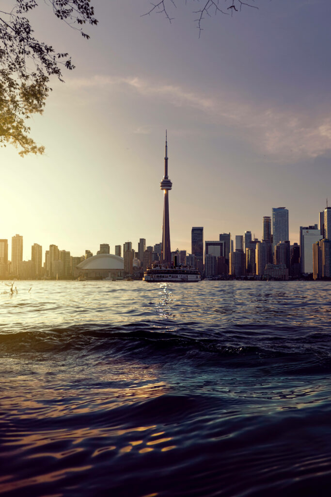 Serene Sunset Wallpaper: CN Tower Reflection on Toronto Skyline