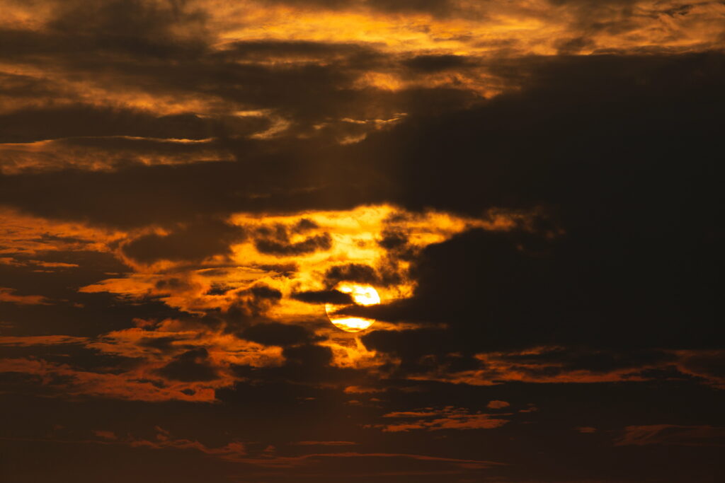 Stunning Sunset Wallpaper: Dramatic Clouds & Golden Sky Background