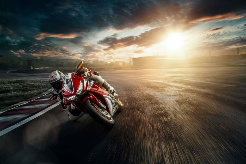 Dynamic Motorbike Rider Sunset Wallpaper for Thrilling Atmosphere