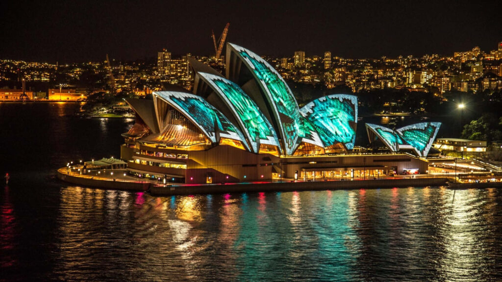 Vibrant Sydney Opera House at Night: Stunning Wallpaper Background