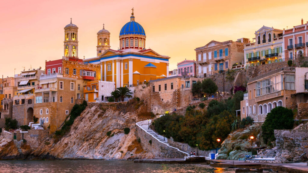 Stunning Syros Architecture Wallpaper: Vibrant Colors at Sunset