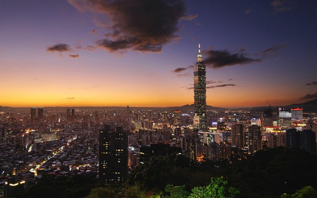 Vibrant Taipei 101 Wallpaper: Stunning Sunset Cityscape Background