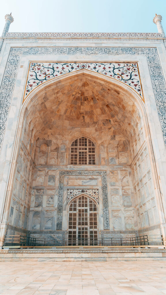 Majestic Taj Mahal Foyer Wallpaper: Intricate Architectural Design