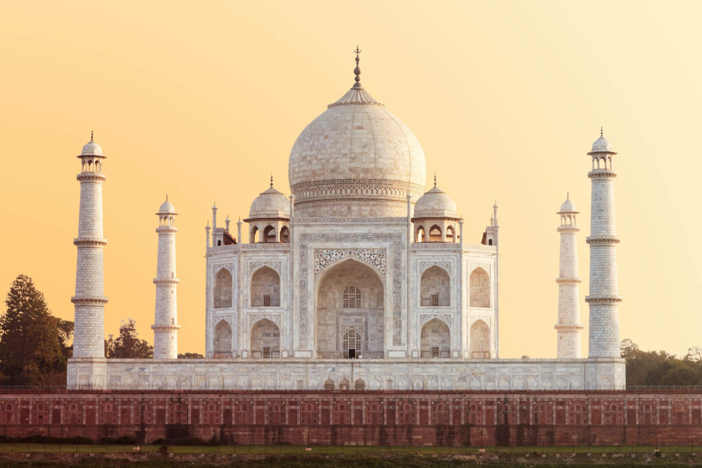 Stunning Taj Mahal Wallpaper: Timeless Beauty Against Yellow Sky
