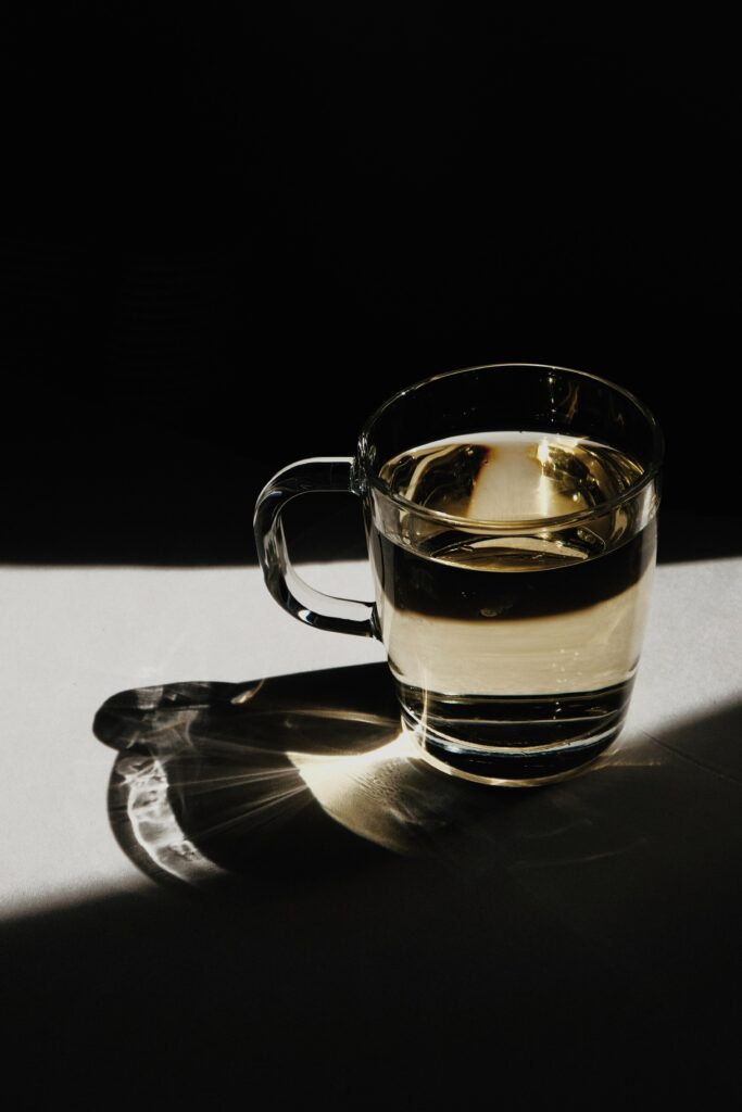 Elegant Tea Cup Wallpaper: Soft Light, Shadows & Reflections