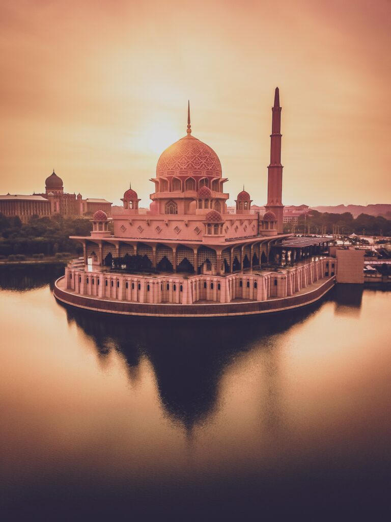 Stunning Temple Wallpaper: Sunset Reflection by Water - Serene Background