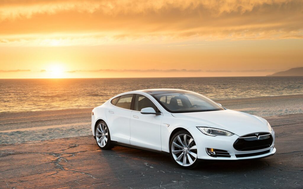 Tesla Model S Sunset Wallpaper: Serene Coastal View