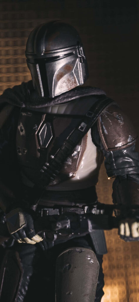 Moody Mandalorian Portrait: Iconic Armor & Helmet Wallpaper