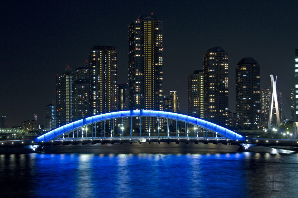 Stunning Tokyo Eitai Bridge Wallpaper: Vibrant Blue Glow Reflection