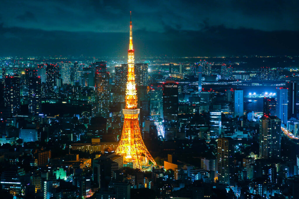 Tokyo Night View: Illuminated Tower and Urban Lights Wallpaper