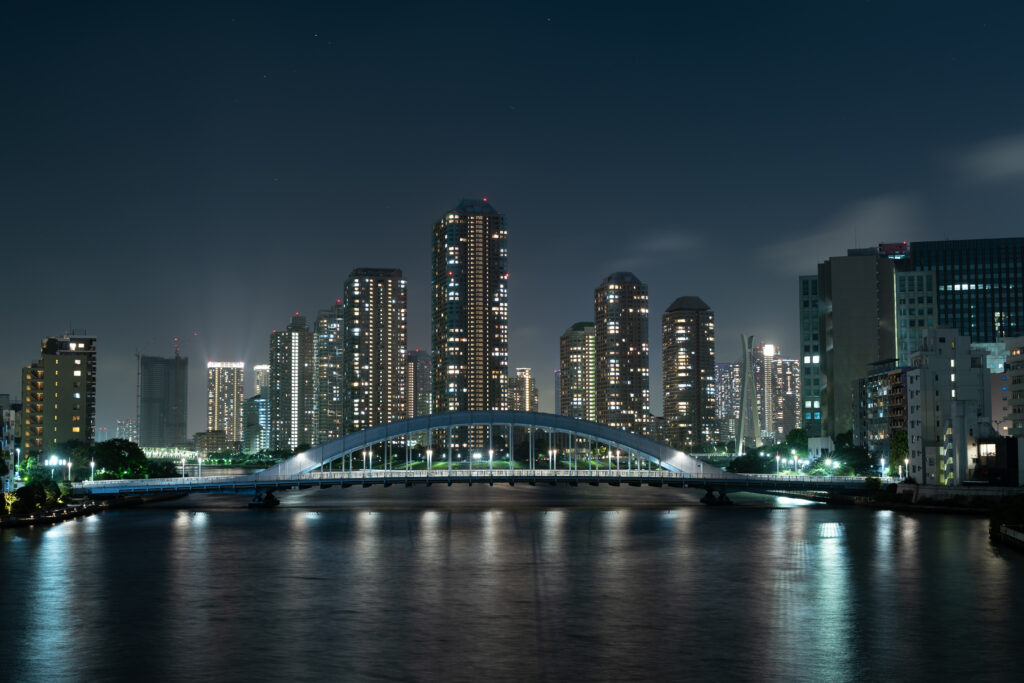 Stunning Tokyo Night View Wallpaper: Illuminated Skyline & River Reflections