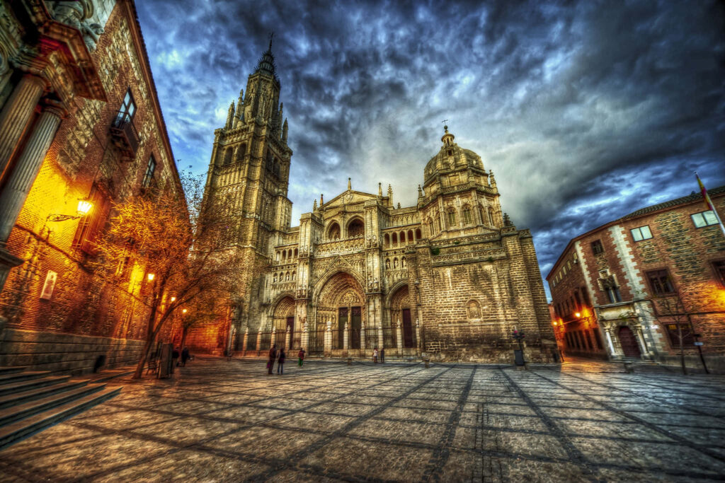 Stunning Toledo Cathedral Wallpaper: Dramatic Sky & Intricate Design