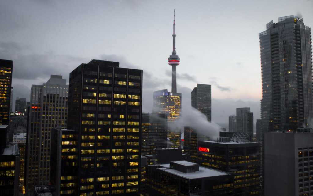 Stunning Toronto Evening: CN Tower Amid Illuminated Skyscrapers Wallpaper