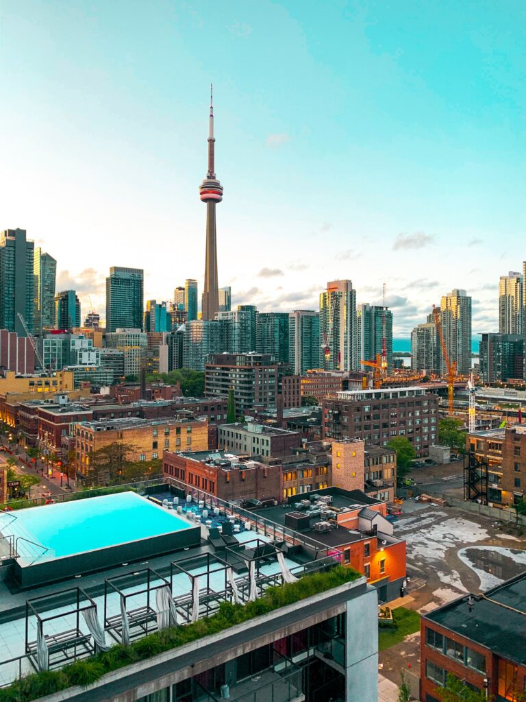Stunning Toronto Cityscape Wallpaper with CN Tower & Rooftop Pool