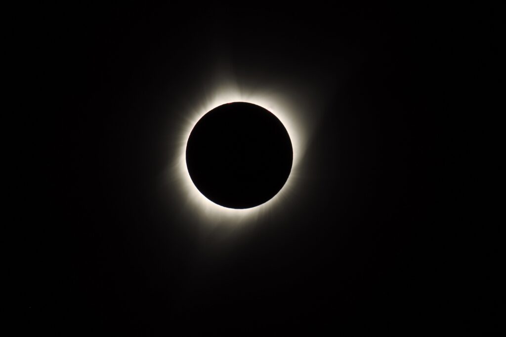 Stunning Solar Eclipse Wallpaper: Moon Obscures Sun, Glowing Corona
