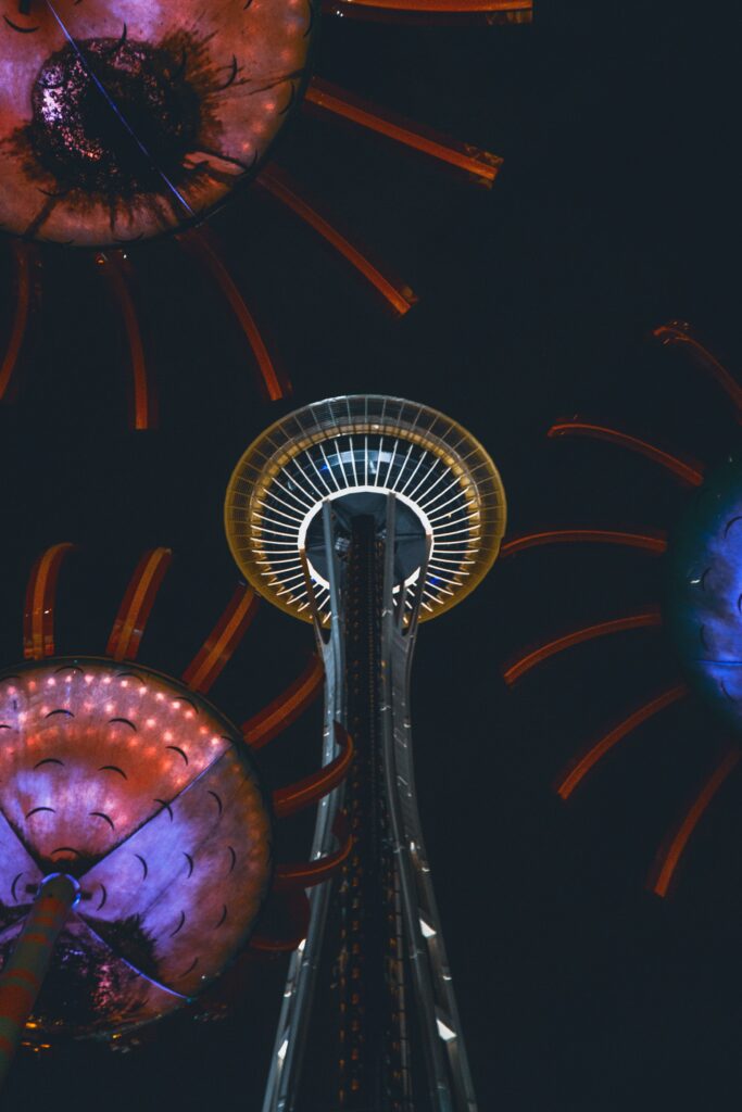 Stunning Night Sky Tower Wallpaper: Futuristic Floral Illumination