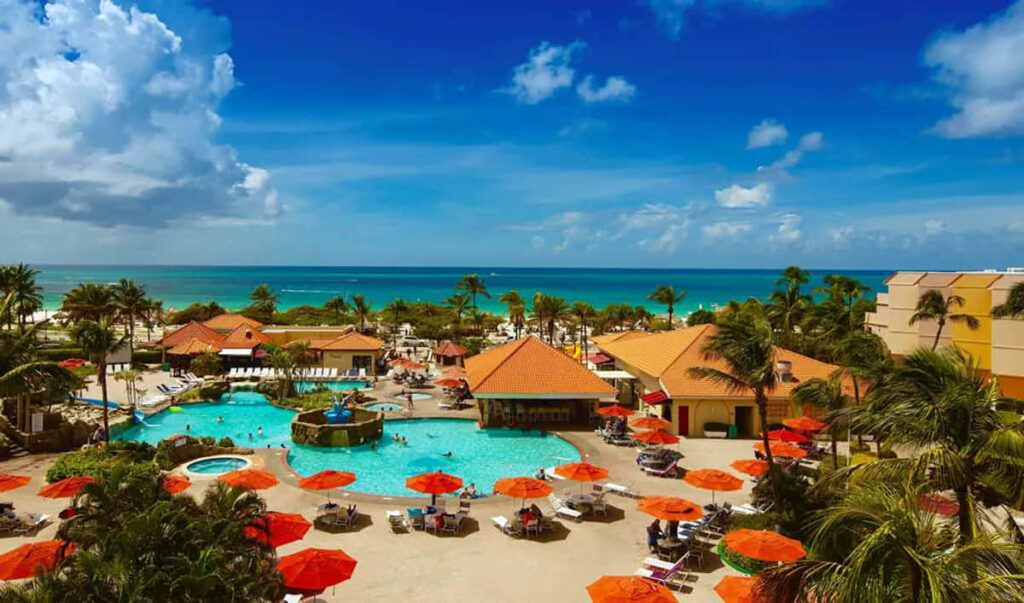 Tropical Beach Resort Wallpaper with Pool and Palm Trees