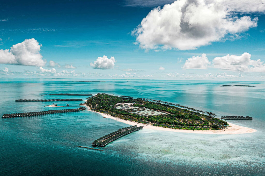 Stunning Aerial Tropical Island Wallpaper: Luxurious Villas & Clear Ocean