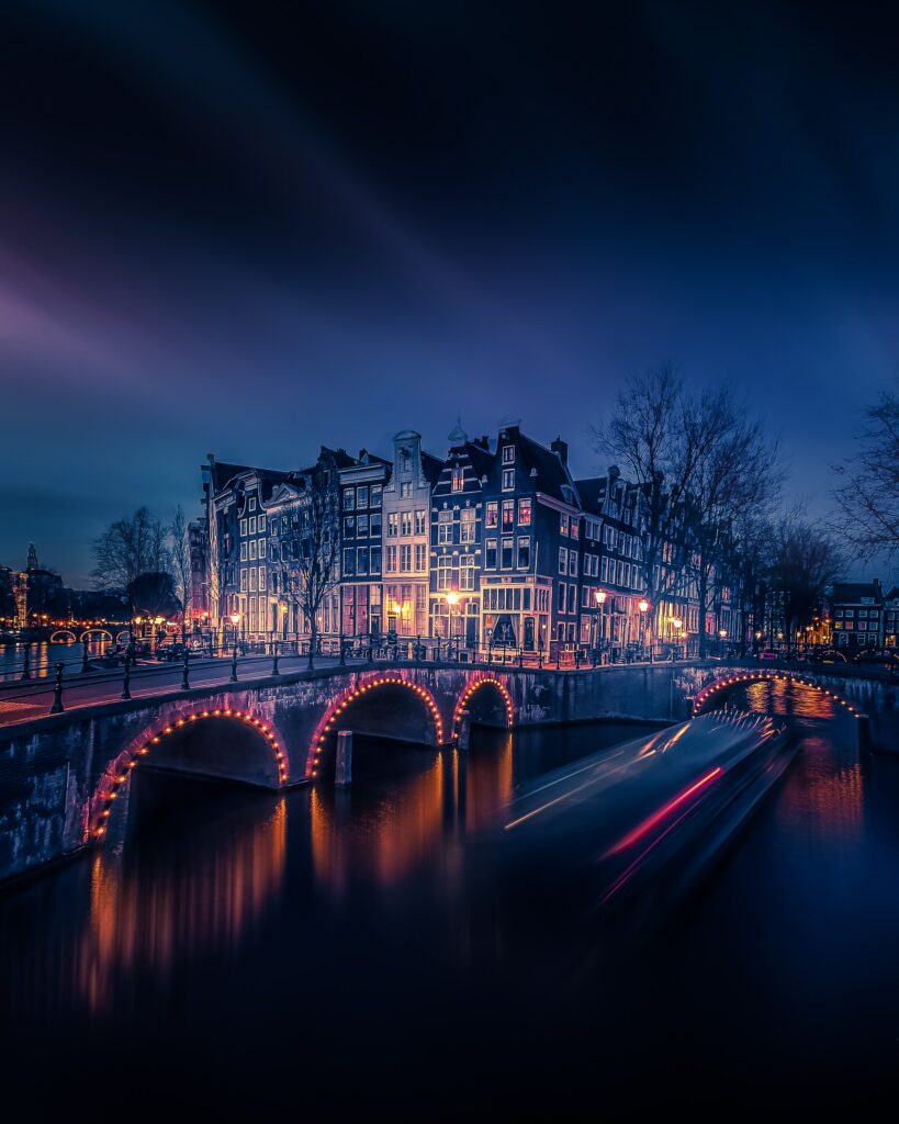 Stunning Twilight Amsterdam Canal Wallpaper: Lit Bridges & Historic Charm