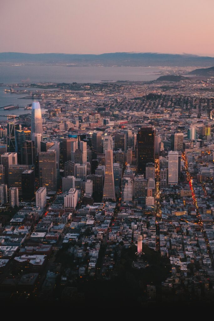 Stunning Twilight Cityscape Wallpaper: Aerial View with Pastel Sky