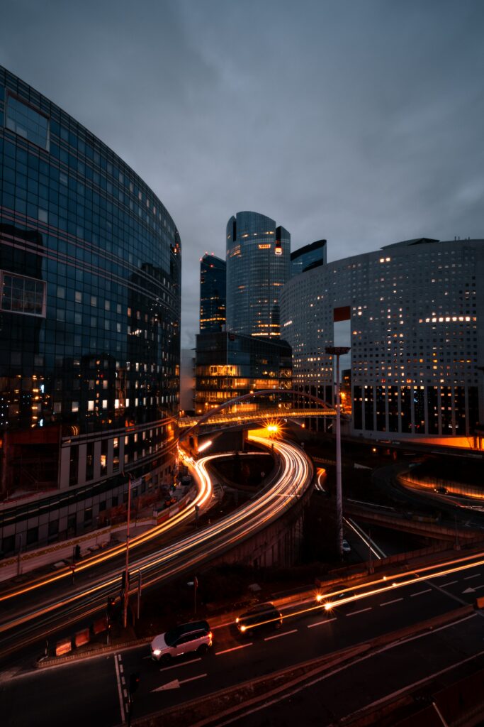 Stunning Twilight Cityscape Wallpaper: Modern Buildings & Light Trails