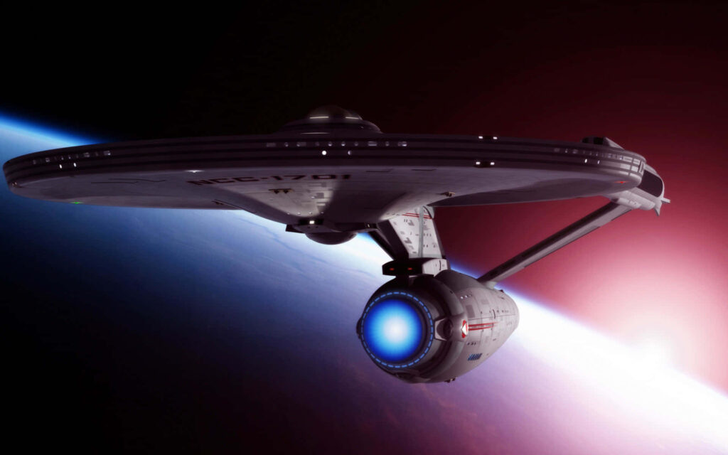USS Enterprise in Stunning Space Wallpaper: Earth in Background