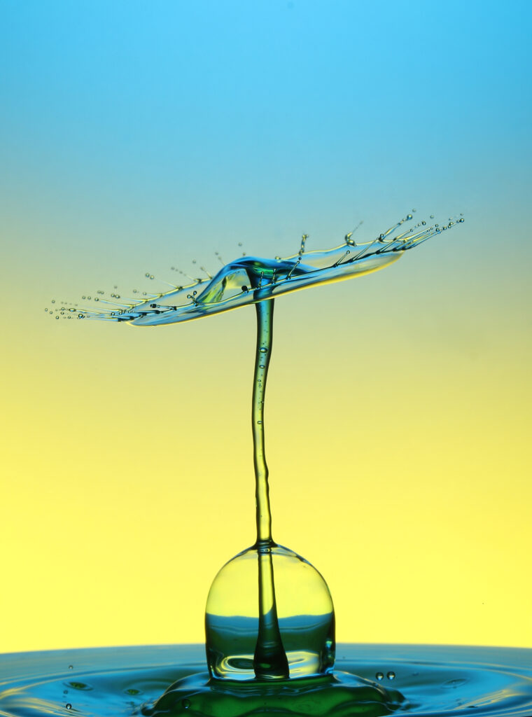 Stunning Macro Water Splash Umbrella | Vibrant Blue & Yellow Wallpaper