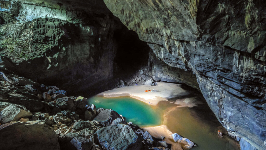 Breathtaking Underground Cave Wallpaper with Turquoise Pool