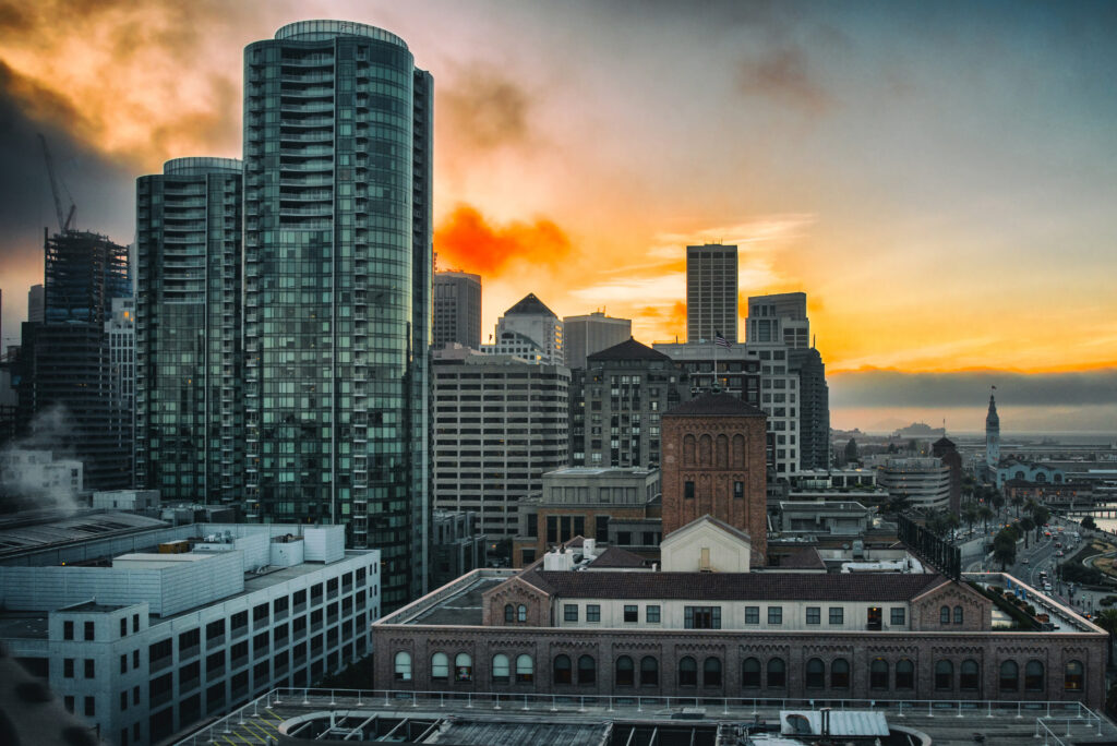 Stunning Urban Cityscape Sunset Wallpaper: Modern & Historic Contrast