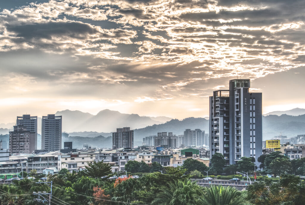 Stunning Urban Cityscape Wallpaper with Hills and Morning Fog