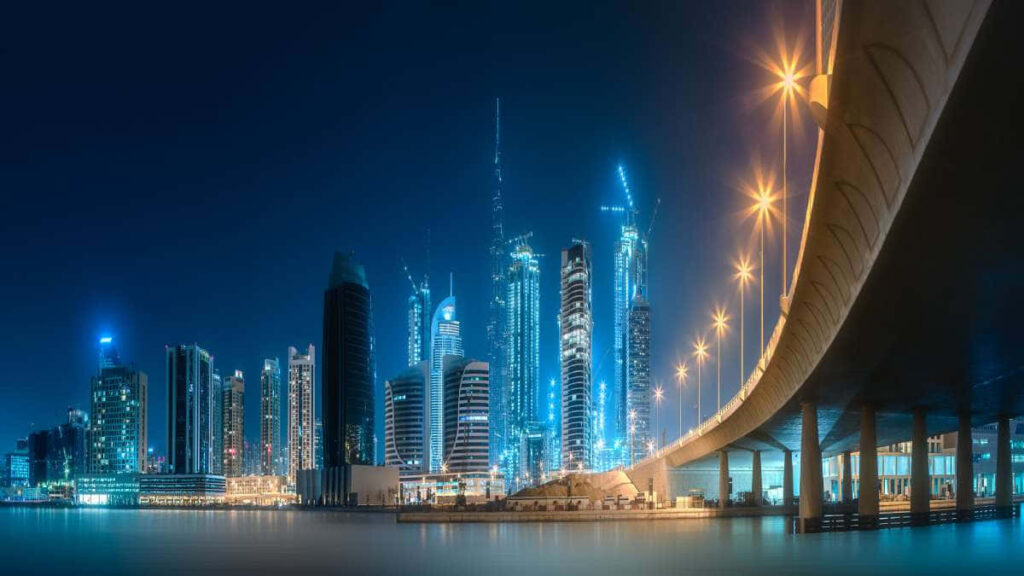 Serene Urban Landscape Wallpaper: Illuminated City & Calm Waters