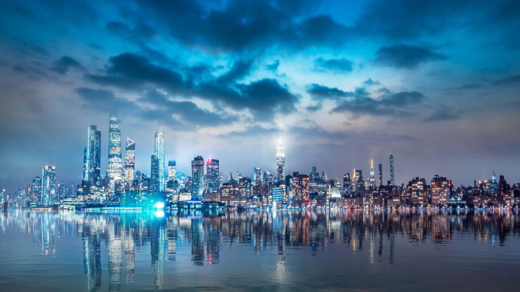 Stunning Night Cityscape Reflection Wallpaper: Illuminated Skyscrapers