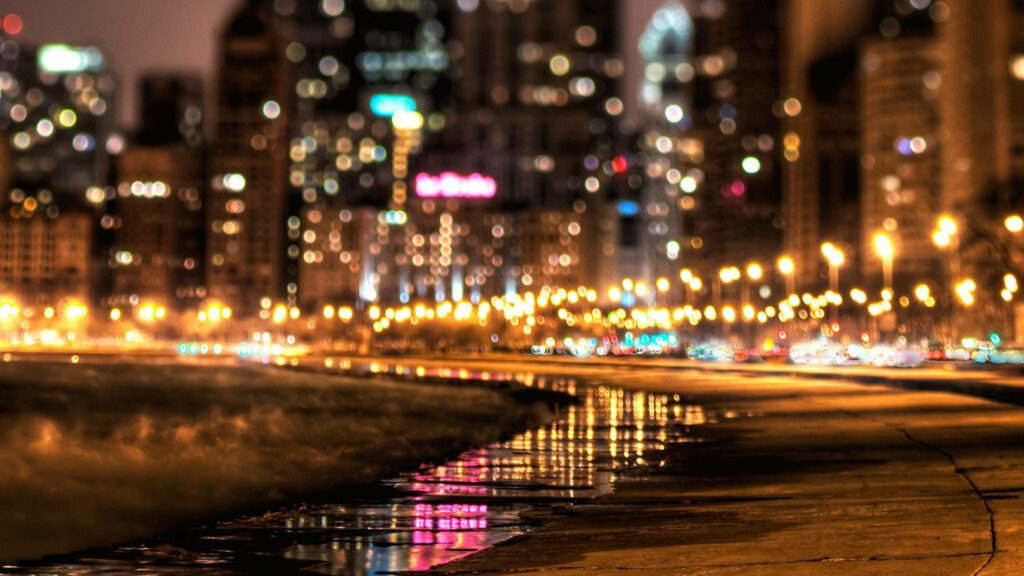 Stunning Nighttime Urban Wallpaper: Orange Cityscape & Reflective Puddle