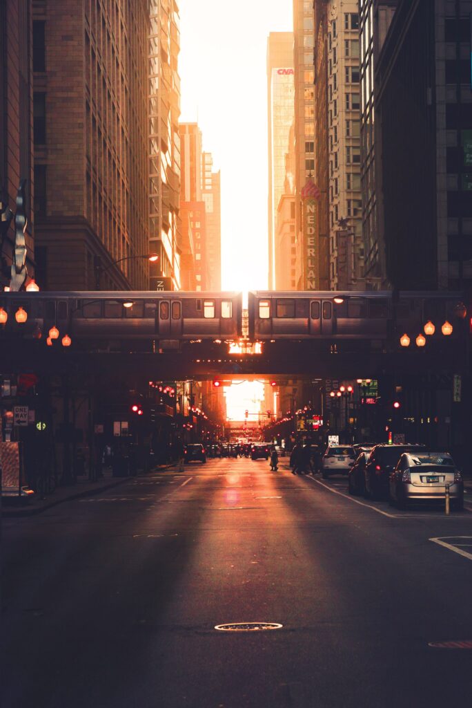 Vibrant Urban Cityscape Sunset Wallpaper with Train in Motion