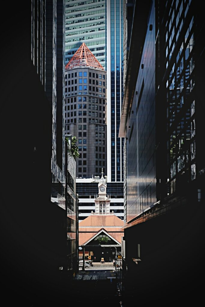 Urban Scene Wallpaper: Skyscrapers & Historic Chapel Blend