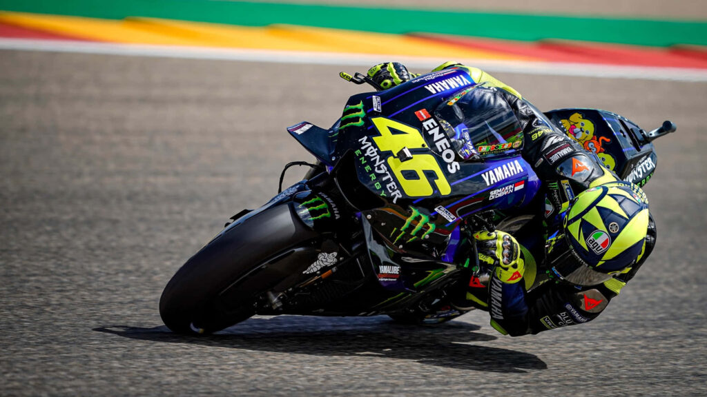 VR46 Action Wallpaper: Iconic MotoGP Racer in Vibrant Racing Suit