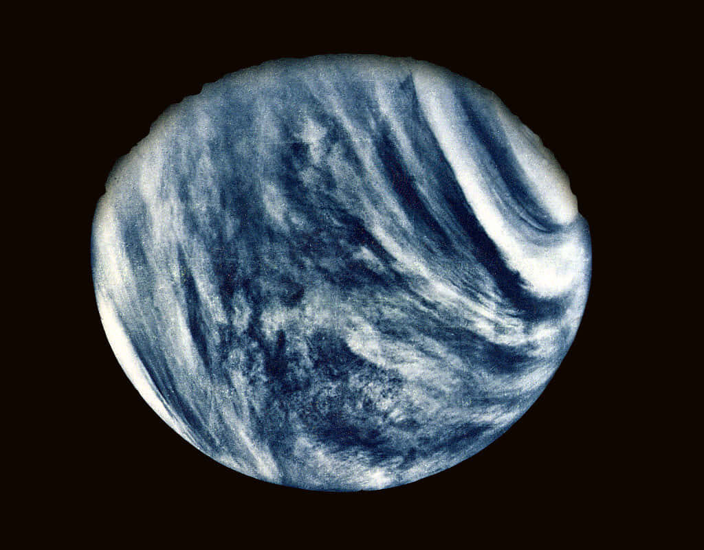 Stunning Venus Wallpaper: Swirling Clouds on Dark Space Background